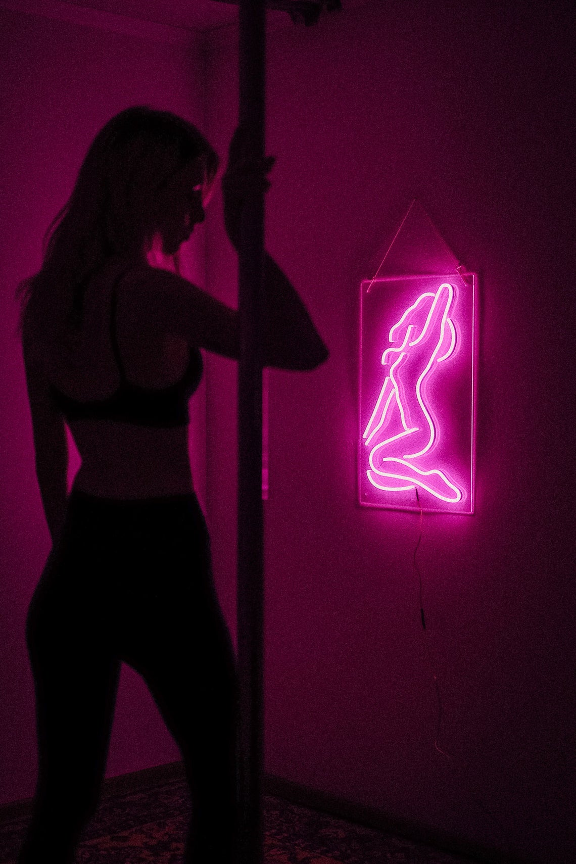 Sexy girl woman pink neon sign for bar, night club, party, erotic striptease